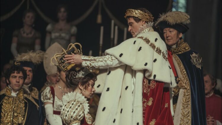 scene from the 2023 film Napoleon where Napoleon is crowning his wife Josephine