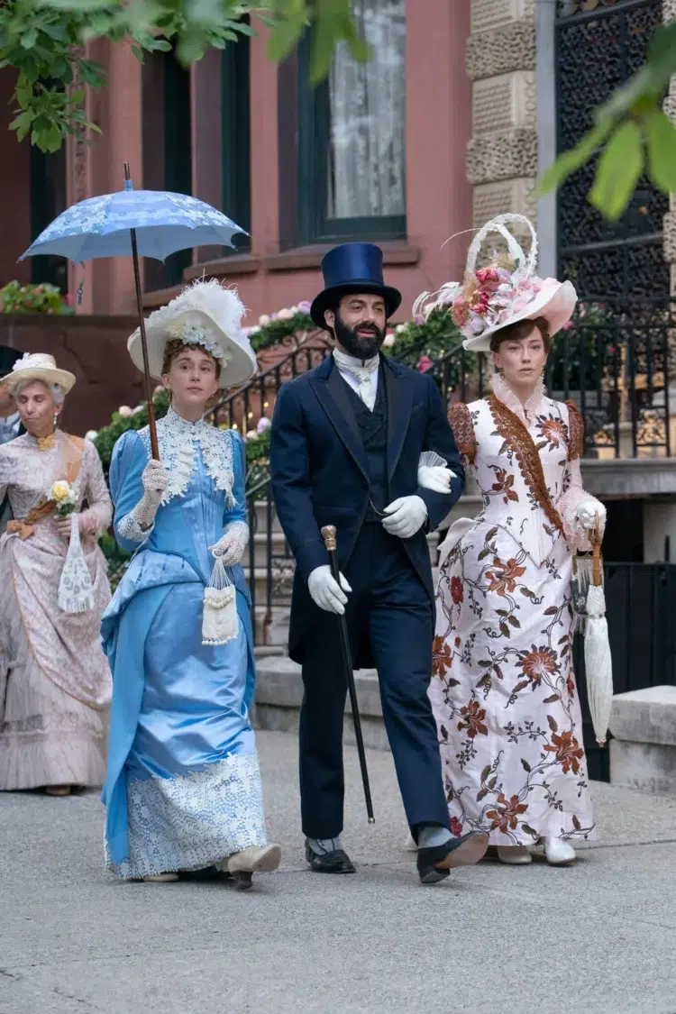 The Russell Family from the Gilded Age walking down a city street dressed up for Easter