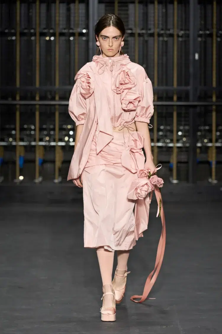 A pale pink dress with rosettes seen at the Simone Rocha Spring 2024 Ready to Wear show