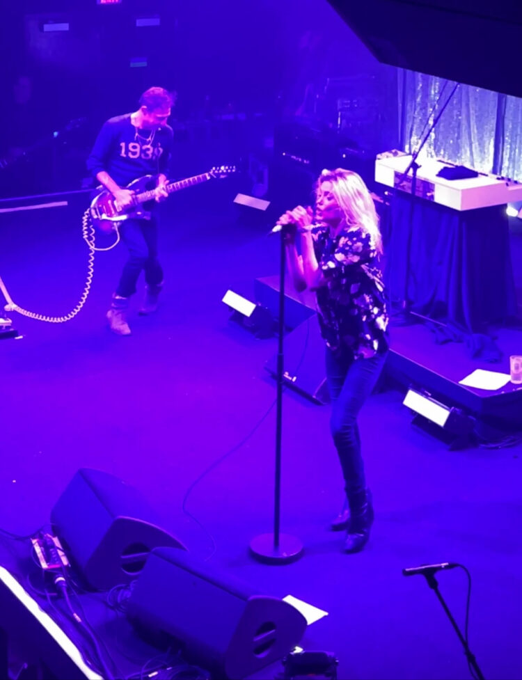 The Kills performing at the 9:30 Club February 2023. Alison Mosshart is singing into a microphone and Jamie Hince is facing her, playing an electric guitar