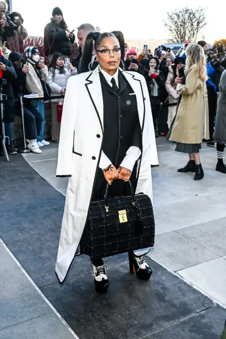 Janet Jackson wearing Thom Browne black and white pants look with an oversized bag at NYFW February 2024