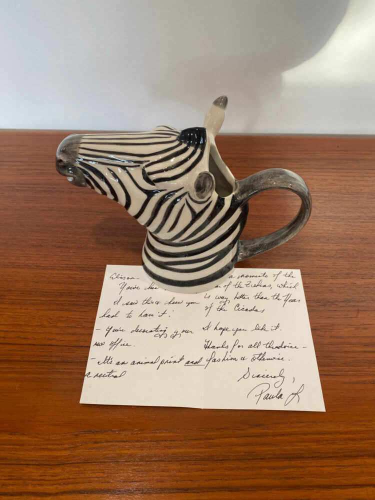 small pitcher in the shape of a zebra head