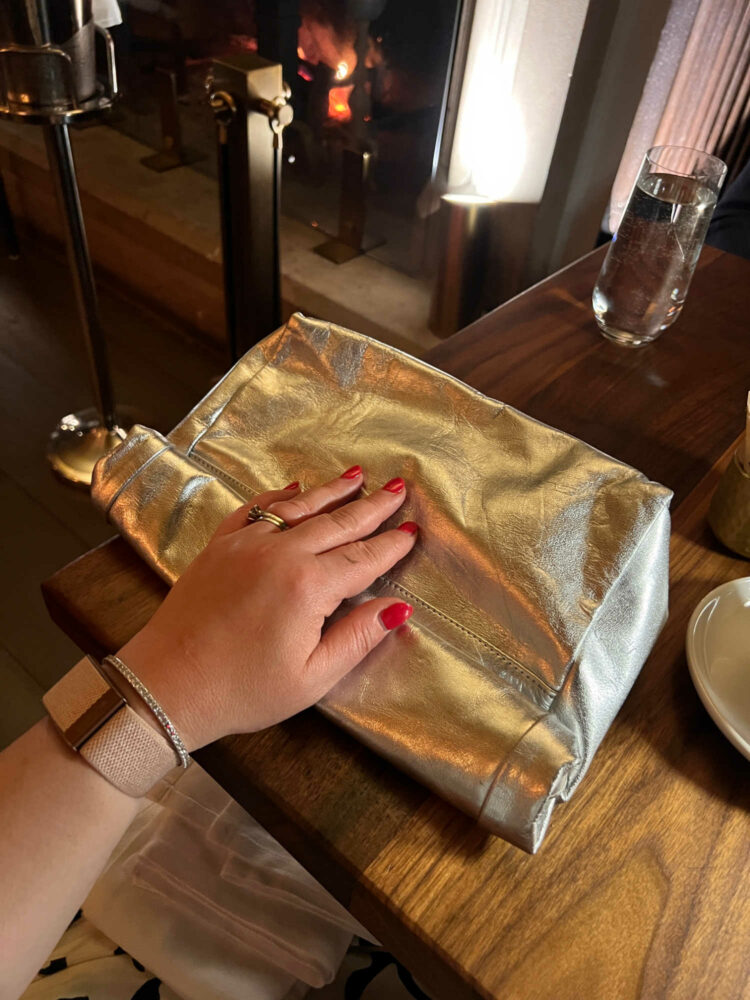 silver faux leather rolled paper bag style clutch from Topshop