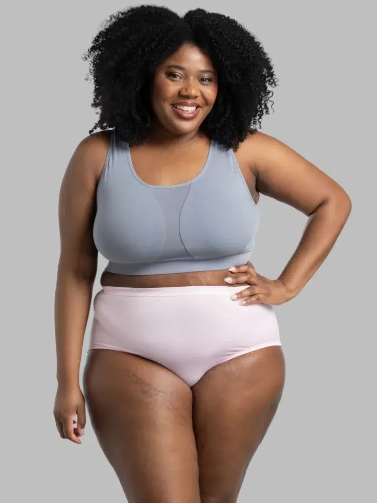 Model wearing a gray bralette and the Fruit of the Loom Women's Plus Fit for Me® Breathable Micro-Mesh Brief Panty in pink