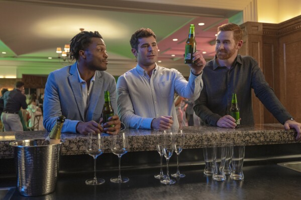 Jermaine Fowler, Zac Efron, and Andrew Santino sitting at a bar in Atlantic City in the Amazon movie Ricky Stanicky