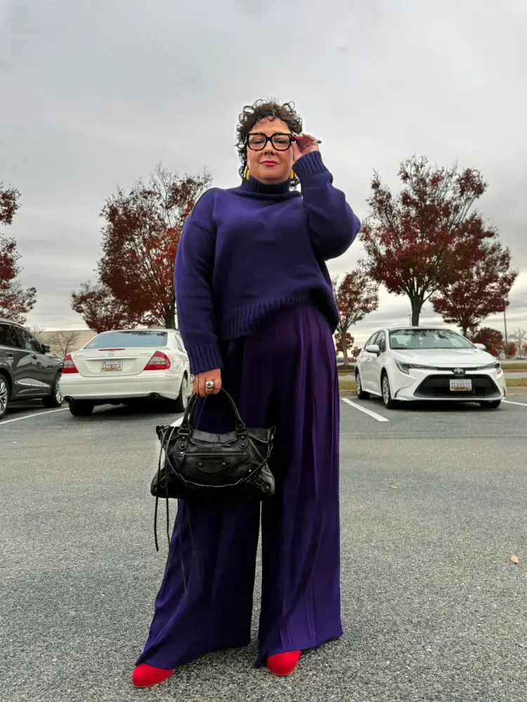 How to Style Wide Leg Pants as a Grown-ass Woman (2026 Guide) 16 Alison Gary of Wardrobe Oxygen in a purple sweater and matching wide leg pants from Ann Taylor