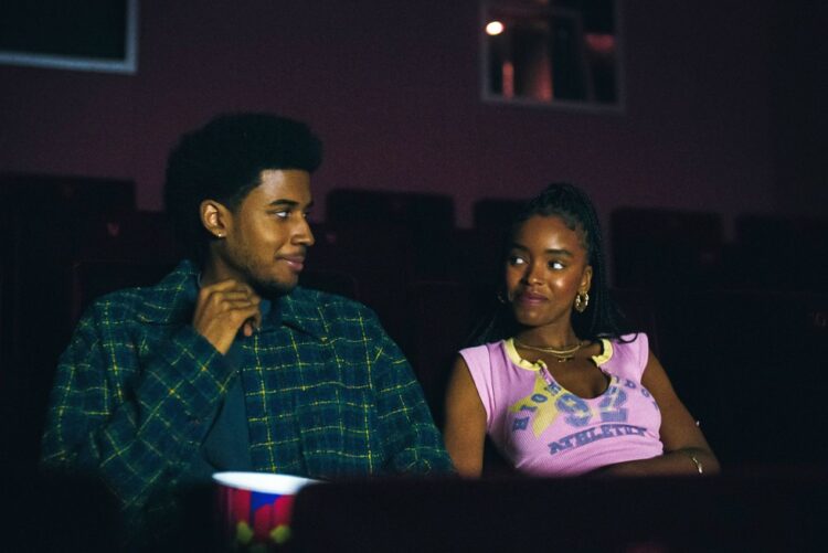 Justin and Keisha from the netflix series forever in a movie theater