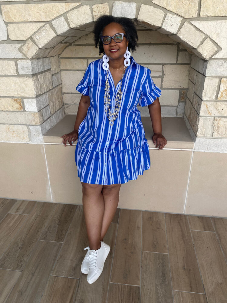 woman wearing a j. crew factory blue stripe dress from summer 2025
