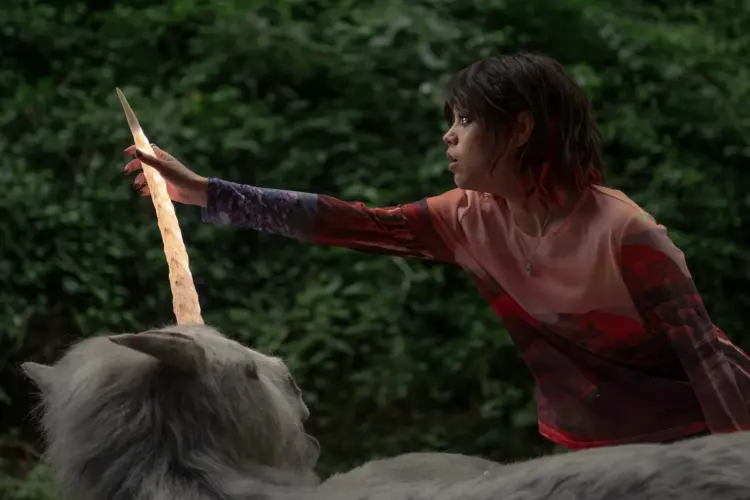 Jenna Ortega holding a unicorn's horn