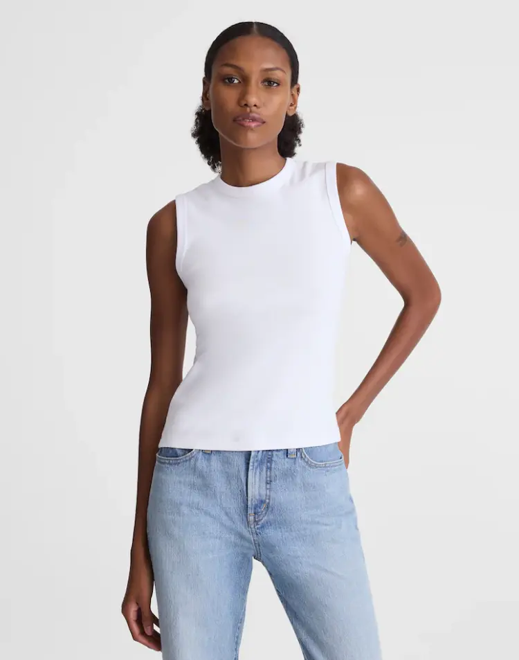 The Best White Tanks for Women That Will Cover Your Bra 3 White Madewell '90s Shell Tank in compact cotton with high crew neckline
