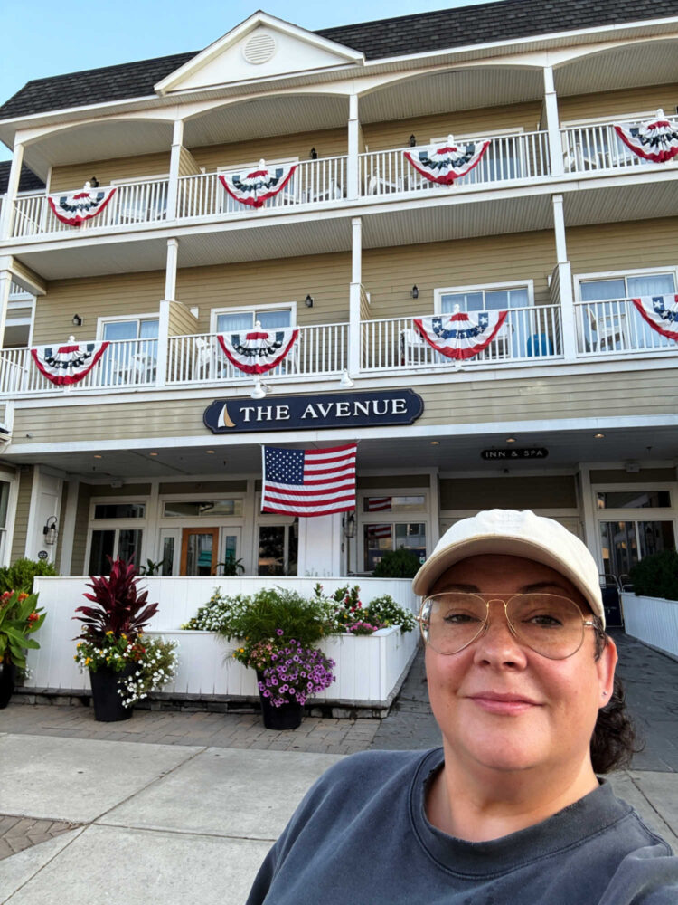Alison Gary of Wardrobe Oxygen standing in front of the Avenue Inn at Rehoboth beach, Delaware