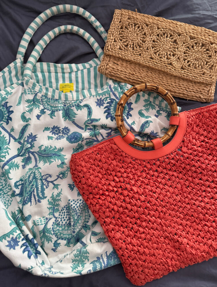 a Roller Rabbit cotton tote, Talbots raffia tote, and a woven straw clutch