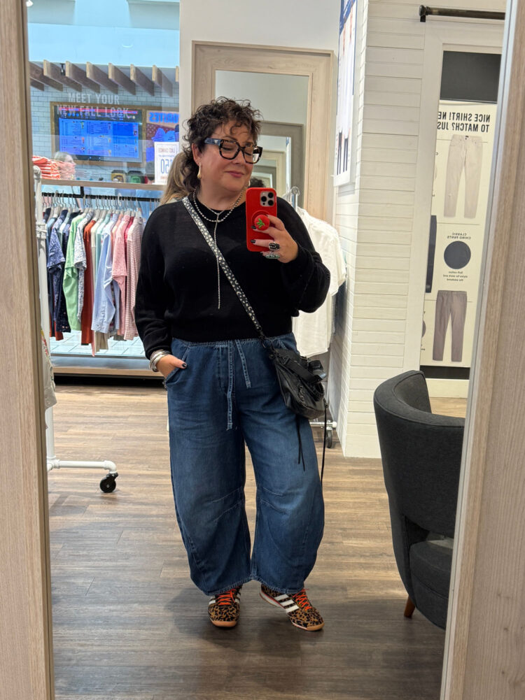 wardrobe oxygen wearing a black cropped sweater with Mid Rise Easy Horseshoe Jeans from Gap