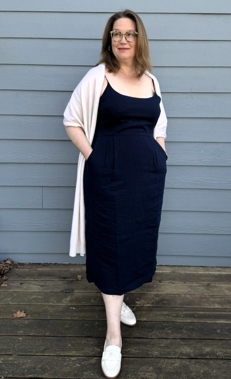 Quince Plus Size Clothing Review: An Honest Community Member Take 6 Tricia wearing the Quince 100% European Linen Scoop Neck Midi Dress in Deep Navy, size 1X, with a white shawl and white loafers