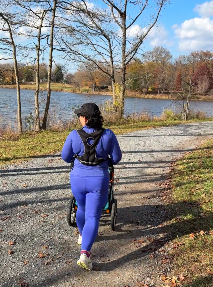 Why I'm Psyched About the Athleta Semi-Annual Sale 3 Alison walking next to a lake in Athleta Borealis flurry top and rainier leggings