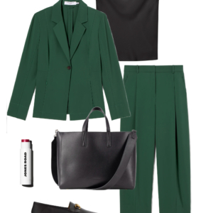 Green blazer with black cowl-neck shell, green trousers, black leather tote, and loafers for the office