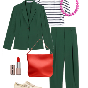 Green blazer over a Breton stripe top with green trousers, red bag, and metallic sneakers for travel
