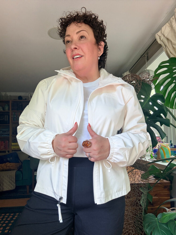 Best Packable Travel Jackets for Women: Stylish Picks from XXS to 3X 1 Alison Gary of Wardrobe Oxygen in the The North Face Daybreak Hooded Jacket