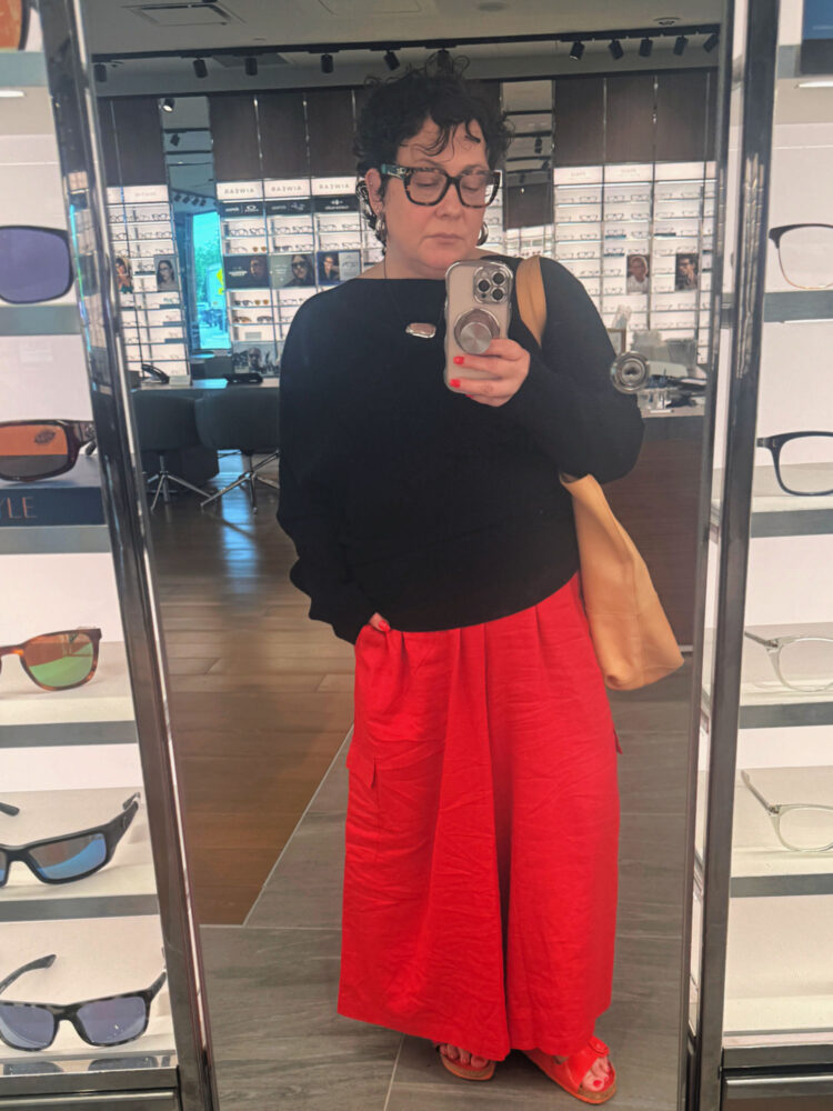 alison in a reiss off the shoulder sweater and Universal standard linen palazzo pants