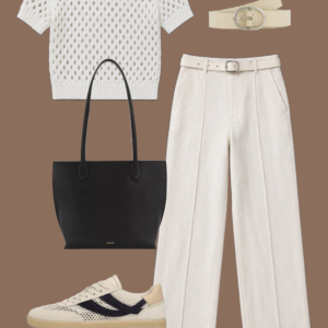 l10 Cream matte jersey bubble top and navy linen ankle pants with a black embossed belt, black leather drawstring pouch, and black flat leather sandals