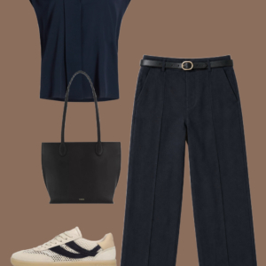 l13 Cream matte jersey bubble top and cream linen full-length pants with a silver-buckle leather belt, black leather drawstring pouch, and black flat leather sandals