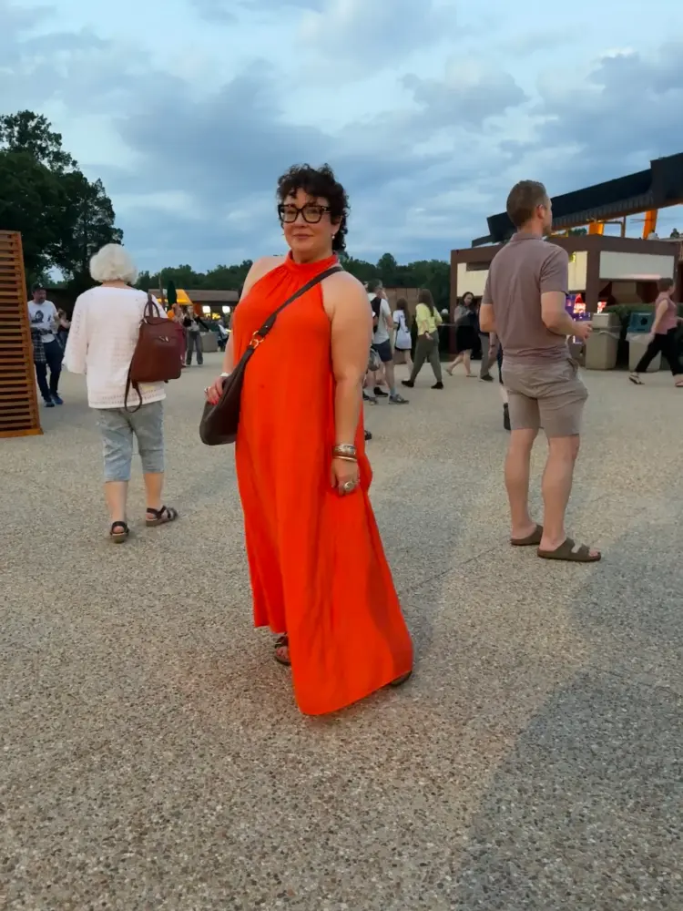 What I Wore Recently: July 2026 5 alison gary in an orange halter maxi dress from COS with a Hyer Goods ring bag in brown leather while at a Tori Amos concert at Wolf Trap